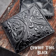 Cowboy Tool black genuine leather Vintage Bi-fold wallet - Available in various styles Discover the perfect blend of sophistication and functionality with our Vintage embossed leather bi-fold wallet. Crafted from high-quality genuine leather, this wallet isn't just an accessory; it's a statement. Key Features: -Distinctive Design: Our unique embossed leather outer material adds a touch of elegance which will set you apart. There are four variations  -Premium Quality: Our wallets are crafted from Vintage Leather Trifold Wallet For Travel, Vintage Bifold Leather Wallet, Artisan Hand-tooled Leather Trifold Wallet, Vintage Hand-tooled Leather Trifold Wallet, Brown Leather-lined Trifold Wallet, Crafts From Recycled Materials, Circular Economy, Leather Bifold Wallet, Card Storage