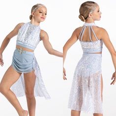 two women dressed in white and light blue dance costumes, one is holding the other's hand