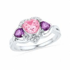 Express your love with this colorful gemstone and diamond fashion ring. Crafted in sleek sterling silver, this ring features an eye-catching heart-shaped lab-created pink sapphire center stone. A heart-shaped frame lined with glistening accent diamonds surrounds this precious pink gemstone, while heart-shaped purple amethysts flank each side. An amazing look for an amazing woman, this ring is finished with a bright polished shine. Custom made to fit her ring size. Sterling silver rings cannot be Purple Engagement Ring, Purple Engagement Rings, Lab Created Diamond Rings, Heart Wedding Rings, Heart Shaped Frame, Diamond Fashion Rings, Peoples Jewellers, Local Jewelry, Pink Gemstones