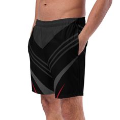 These men's swim trunks are perfect for a hot summer day. They are quick-drying, breathable, and have multiple pockets for your belongings. The silky, anti-chafe inner liner ensures maximum comfort. The trunks feature a stylish striped black, red, and gray geometric line pattern with a boho aesthetic and art deco design. These swim trunks are a great choice for anyone looking for a comfortable and fashionable bathing suit for summer activities. Don't wait, get yours now! • Fabric composition: (may vary by 5%) 91% recycled polyester, 9% spandex• Liner composition: 92% polyester, 8% spandex• Fabric weight (may vary by 5%): 5.13 oz/yd² (174 g/m²) • Four-way stretch water-repellent microfiber fabric• Anti-chafe mesh inner liner• Elastic waistband with drawcord• Mesh pockets• Small inside pocke Black Swim Trunks With Built-in Shorts For Beachwear, Black Swim Trunks With Pockets For Vacation, Black Swimwear Shorts With Pockets, Black Nylon Shorts For Beach Season, Moisture-wicking Swimwear For Sports, Short Swim Trunks For Summer Sports Events, Black Moisture-wicking Shorts For Vacation, Black Breathable Swimwear For Beach, Summer Short Swim Trunks For Sports