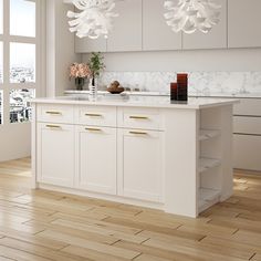 a kitchen with white cabinets and marble counter tops on hard wood floors in front of large windows