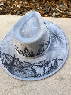 "This boho western hat would be perfect with just about any outfit. It is a stiff hat, made of high quality vegan suede, meant to hold its shape.  If you'd like completely custom design instead, please go to this link to order one made just for you! https://etsy.me/3rod0CN 💜 H A T   S I Z I N G   Tightening band inside  Hat Circumference: 20.5-23\" Brim Width: 4\" Extra large size available, upon request  💜 S H I P P I N G Turnaround time can take 2-3 weeks depending on how many orders I have, and how detailed your design is.  I ship USPS  💜 R E T U R N S   &   E X C H A N G E S Being that my items are so customized to your specifications, I do not offer refunds or exchanges. Please check your sizing before ordering, as I cannot refund or exchange due to hat sizing issues. BUT if there Western Hat Burning Ideas, Hat Art, Painted Cowboy Hats, Hat Burning Ideas