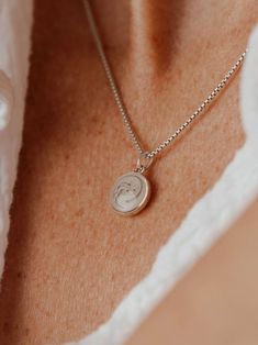 CBM-294 Evoking the beauty of a pearl, this 14k rose gold circular cremation pendant was designed with a dome effect to add an extra later of depth to its ashes setting. The 10mm dome pendant is solid 14k rose gold, but comes with a 14/20 rose gold-filled chain in the length of your choice from the options below. Information about matching solid 14k gold chains is available by request as well. This pendant can be engraved with up to 10 characters, including spaces and simple symbols, in a single Rose Gold Medallion Jewelry With Engraving Option, Rose Gold Round Pendant Jewelry With Engraving Option, Rose Gold Pendant Jewelry With Engraving Option, Rose Gold Round Jewelry With Engraving Option, Minimalist Keepsake Jewelry, Rose Gold Jewelry With Pearl Pendant, Rose Gold Minimalist Jewelry For Keepsake, Rose Gold Sterling Silver Necklace, Tarnish Resistant Round Pendant Jewelry For Keepsake