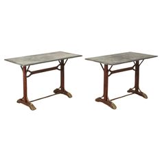 a pair of tables sitting on top of each other in front of a white background