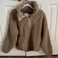 Half Zip Pull Over. Never Worn, No Stains Or Rips. Oversized And Super Soft. Beige Fleece Tops For Fall, Cozy Beige Tops For Cold Weather, Brown Fleece Sweater For Fall, Cozy Brown Sweatshirt For Fall, Cozy Brown Top For Cold Weather, Cream Fleece Sweater For Fall, Cozy Brown Fleece Sweater, Cozy Beige Fleece Sweatshirt, Beige Fleece Winter Top