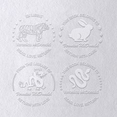 four different logos on white paper with the word love and animals in each lettered circle