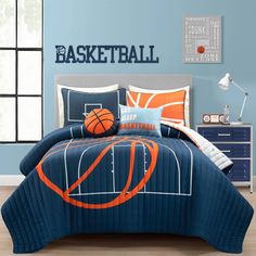 a basketball themed bed in a bedroom with blue walls