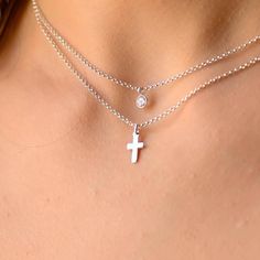 This layered silver cross necklace is a set of 2. The chains are solid sterling silver 925. They have an extension so that the size can be adjusted. The one necklace has a tiny cz charm on a chain while the other has a small cross on it. Elegant Silver Diamond Crucifix Necklace, Elegant Nickel-free Silver Cross Necklace, Nickel-free Silver Cross Necklace, Formal Cross-shaped Sterling Silver Diamond Necklace, Adjustable Silver Cross Necklace, Nickel Free, Layered Cross Necklace, Cross Necklace Women, Dainty Cross Necklace, Tiny Cross Necklace