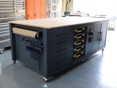 a large workbench with many drawers on it