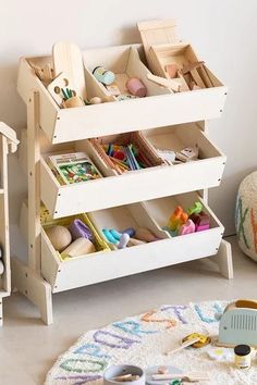 a child's toy storage unit in the corner of a room