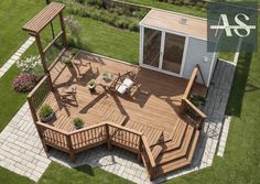 an aerial view of a wooden deck with seating and pergolated patioing area