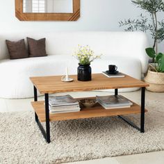 a coffee table sitting on top of a white rug