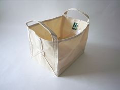 a canvas tote bag sitting on top of a white table