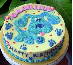 a birthday cake decorated with an image of a dog