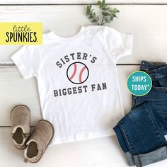 Baseball Season Shirts for Kids, Sisters Biggest Fan Toddler T-Shirt, Game Day Shirts PRODUCTION TIME Little Spunkies from the designer/owner of Spunky Pineapple Co https://www.etsy.com/shop/SpunkyPineappleCo   All baby and toddler clothes are 100% designed and printed with water based ink. All orders placed before 12:00 pm EST are shipped out same day (Monday - Friday). Orders received after noon are shipped out the next business day. ONESIES® BRAND  Made from 100% Cotton. We print on Onesies® Brand and do recommend ordering up one size as these run a little small after washing. T-SHIRT Made from 100% Cotton. These run true to size. If you are in between sizes we suggest sizing up. RAGLAN Made from 52% Cotton / 48% Polyester. These run true to size. If you are in between sizes we suggest Baseball Sister, Baseball Girls, Baseball Season, Game Day Shirts, Sister Shirts, Kids Graphic Tees, Baby And Toddler, Fan Shirts, Toddler Clothes