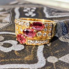 Ring Size: US 7 1/2 EU 56 Gold 19k Weight:  10.0 grams Diamonds 0.80 ct. Clarity: Si Color: G Natural Ruby 1.50 ct  Condition: Excellent Introducing the Ruby and Diamond 19k Gold Unisex Statement Ring, a captivating masterpiece of fine jewelry that exudes timeless elegance and individuality. Crafted with the utmost precision and attention to detail, this exceptional ring seamlessly combines the rich allure of rubies and the dazzling brilliance of diamonds with the lustrous beauty of 19-karat gol Luxury Yellow Gold Gia-certified Sapphire Ring, Luxury Gia Certified Yellow Gold Sapphire Ring, Luxury Emerald Cut Rings Of Aaa Quality, Fine Jewelry Yellow Gold Rings, Luxury Emerald Cut Rings With Aaa Quality, Luxury Emerald Cut Aaa Quality Rings, Aaa Quality Fine Jewelry Yellow Gold Rings, Fine Jewelry Gold Ruby Ring Gia Certified, Elegant Gia Certified Gold Ruby Ring