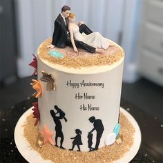 a wedding cake is decorated with an image of the couple and their child on top