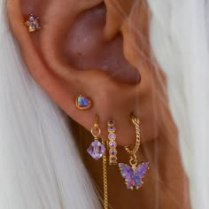 Big Ear Piercings, Stacked Earrings Aesthetic, Colorful Ear Styling, Pink Earring Stack, 2000s Ear Piercings, Gold And Pink Ear Piercings, Ear Piercings Y2k, Ušný Piercing, Pretty Ear Piercings