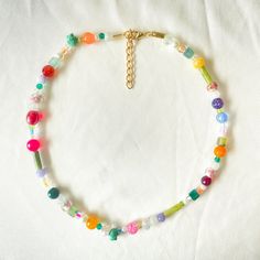 Beaded spring themed necklace! Bohemian Beaded Necklace For Spring, Bohemian Beaded Chain Necklace For Spring, Handmade Playful Summer Necklaces, Playful Handmade Summer Necklaces, Colorful Beaded Necklaces For Spring, Colorful Round Beaded Necklaces For Spring, Spring Colorful Beaded Necklaces, Spring Beaded Chain Jewelry Gift, Spring Tiny Round Beaded Necklaces