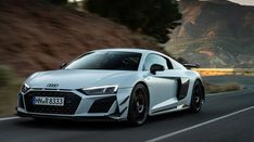 an audi sports car driving down the road