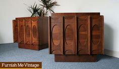 three wooden furniture pieces sitting on top of a carpeted floor next to a potted plant