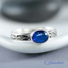 "This Sterling Silver Oval Blue Sapphire Ring has an 8 mm x 6 mm oval gemstone of your choice securely set in fine silver. This comfortable ring makes an a striking Promise Ring, Stacking Ring, Birthstone ring or Stocking Stuffer for your special someone or yourself! We are happy to create this ring with your choice of the stones shown, in a wide range of ring sizes, and finish options. The oval stone in this ring measures 8 mm x 6 mm and is vertically set on a 3 mm wide Sterling Silver band. Th Classic Oval Blue Moonstone Ring, Blue Polished Moonstone Ring For Gift, Blue Polished Moonstone Ring Gift, Classic Blue Moonstone Ring For Anniversary, Blue Oval Moonstone Ring With Polished Finish, Oval Blue Moonstone Ring With Polished Finish, Sapphire Promise Rings, Ring Blue Sapphire, Sterling Silver Stacking Rings