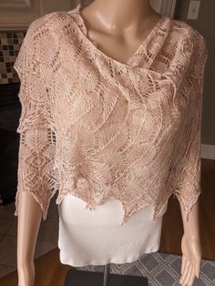 Soft dusty rose pink lace shawl with iridescent beads in the body and copper lined crystal beads on the bottom points.  Hand knitted with 50% yak down, 50% silk yarn.  Approximately 80" from end to end and 25" at the widest point.  Great for any special occasion.  Pattern from Boo Knits. The combination of yak and silk make a lovely drape!  The yarn has some slight variations in color of soft pink making it very unique. Elegant Lace Shawl Scarves, Pink Bohemian Shawl For Wedding, Elegant Fitted Lace Shawl, Fitted Shawl For Mother Of The Bride, Elegant Cream Lace Shawl, Lace Shawl Scarf For Weddings, Elegant Handmade Scarves For Weddings, Lace Wedding Scarf Shawl, Elegant Lace Shawl