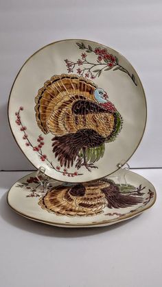 two turkey plates sitting on top of each other