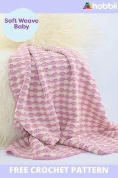 a pink and white knitted baby blanket on top of a sheepskin rug with the text, soft weave baby free crochet pattern