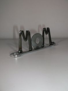 the word mom is made out of metal