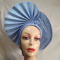 This Sego Gele Headtie Turbans for Women Hats is a must-have for any fashionista. It is made from 100% cotton and features an embroidered design. The width is 1 and it is eco-friendly. It is made in Guangdong, Mainland China. This headtie is already made and ready to wear. It is perfect for any special occasion or just to add a touch of style to your everyday look. It is sure to make a statement and turn heads wherever you go. This Sego Gele Headtie Turbans for Women Hats is a great way to add a Turbans For Women, Women Hats, Aso Oke, Design Dresses, Blue Peach, African Design Dresses, African Design, How To Make Light, Turbans