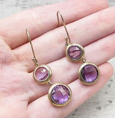 "Jewelry Type: Earrings  Metal Type: Gold Over 925 Silver  Metal Size: 1.75\"  Stone Type: Amethyst   Condition: N/A  Jewelry Weight: 4.6 Grams   Please Note: This item is pre-owned. It may contain scratches, scuffs, dents, markings, engraving, be broken, and/or be tarnished. We make a very strong effort to upload clear pictures. Please inspect all pictures and ask all questions you may have prior to making a purchase. Not all stones are genuine. Some are enhanced or man-made." Purple Faceted Earrings For Anniversary, Faceted Amethyst Round Earrings, Amethyst Drop Earrings For Anniversary, Nickel-free Amethyst Earrings For Anniversary, Nickel Free Amethyst Earrings For Anniversary, Anniversary Amethyst Earrings, Nickel Free, Round Amethyst Gemstone Earrings, Gold Gold, Round Cut