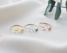 "Our Letter Ring is made of high quality materials and has an elegant design. Each birthstone represents a particular month of birth and these stones are associated with love, luck and special meanings. Birthstone silver letter rings are finished with a birthstone representing your birth month. Each birthstone reflects your personality and energy. These rings emphasize the natural beauty and uniqueness of you or your loved ones. Thanks to the gold plated and rose gold plated options, you can choose your ring according to your personal style. While gold plated rings offer a classic and elegant look, rose gold plated rings reflect a romantic and modern style. Things to consider when using silver jewelry: - You should not contact silver jewelry with chemicals. (Soap, shower gel, shampoo, etc. Personalized Initial Ring, Letter Rings, November Birthstone Jewelry, Peridot Birthstone, Personalized Wedding Rings, Engraved Wedding Rings, Infinity Jewelry, Fingerprint Jewelry, Rings And Bracelets