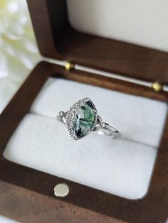 This ring is a special and unique piece of jewel for you your best friends and a perfect gift for all Bride lovers. It is made entirely of pure sterling silver 925. The rings comes with the shape of a white crescent moon holding a shiny and bright moss agate, a natural gemstone with inside filaments and patterns of green moss. Each moss agate will be different which makes this ring unique. Product details: Material: Sterling Silver 925 Color: Silver Ring Size: 5us, 6us, 7us, 8us, 9us, 10us, 11us Gift Crystal Ring With Halo Setting, Adjustable Oval Emerald Ring For Gift, Unique Moss Agate Ring For Wedding, Heirloom Crystal Ring As A Gift, Heirloom Crystal Ring As Gift, Heirloom Crystal Ring For Gift, Unique Moss Agate Rings For Anniversary, Unique Moss Agate Wedding Ring, Handmade Agate Rings As Gift