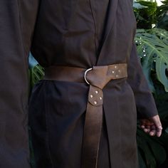 PRODUCT DESCRIPTION: This Medieval Viking Belt for Men is a perfect fit for LARP, Renaissance Festivals, Cosplay, Halloween, Costume Parties, or any outfit that needs a touch of rustic or historical style. The closure is a Half-Ring style, which is easy to use and wear-resistant. MATERIAL TYPE: Full Grain Leather - Our products are built to withstand the wear and tear of everyday use. Each product is handmade from top quality, full grain leather, making these accessories ready for the outdoors a Viking Belt, Leather Making, Belt For Men, Costume Parties, Leather Gear, Cosplay Halloween, Unique Materials, Ring Style, Larp