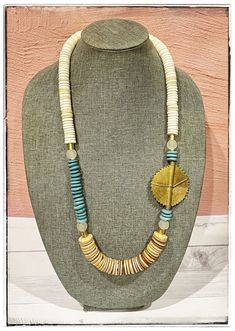 "Traditional Brass Baule Bead Pendant / Tan Coconut Wood / Blue Ashanti & Recycled Glass Bead / Boho Long Statement Necklace / Gold Drum Bead   We can customize any item!  Contact me to create your perfect necklace❤️ * Handmade item made in a clean, sanitized, & safe environment. Made with Love ❤️❤️ * Bead material- Wood, Glass & Bone beads * White Wood Beads * Tan coconut wood disk bead * Recycled glass bead * Ashanti glass disk bead- light blue teal * Striped bone disk bead * Length- 17\" top Round Beaded Necklaces With Large Beads For Beach, Statement Necklace Gold, Coconut Wood, Long Statement Necklace, Recycled Glass Bead, Necklace Ideas, Gold Statement Necklace, Bead Pendant, Summer Necklace