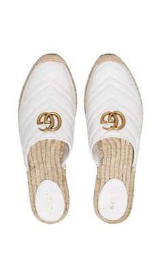 Gucci's Pilar espadrille slippers are crafted from matelassé chevron leather. Set on a classic woven sole for a laid-back edge, brushed gold-tone Double G hardware delivers a recognisable vacation-ready finish.Smooth leatherQuilted Contrasting logoGolden finishesContrast stitchingComposition: Leather 100%, metal 100%Lining Composition: Straw 100%Sole Composition: Rubber 100%Made in Italy Gucci Espadrilles, Open Toed Heels, Buy Gucci, Leather Espadrilles, Gold Ounce, Gucci Shoes, Heel Sandals, Smooth Leather, Mule