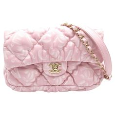 This Chanel shoulder bag is constructed of soft quilted lambskin leather with the Chanel name and logo printed throughout the exterior. The bag features light gold metal, a metal and pink lambskin threaded shoulder strap and a classic CC turn lock closure. The flap opens to a pink fabric interior. Color: Pink Material: Lambskin leather Year: 2023. Microchipped bag Measures: Height 6” x Length 8.7” x Depth 2.5” Drop: 11” double strap & 21” single strap Comes with: Dust bag Condition: New. Pristin Pink Quilted Leather Bag, Designer Quilted Crossbody Bag, Designer Quilted Top Handle Bag, Designer Quilted Rectangular Shoulder Bag, Designer Quilted Satchel Shoulder Bag, Luxury Quilted Satchel Bag, Chanel Print, Chanel Store, Vintage Chanel Handbags