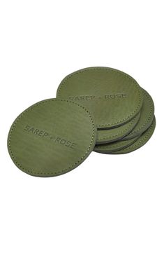 three green coasters with the name care and rose on them, sitting next to each other