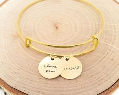 This personalized gold anniversary bangle makes the perfect anniversary gift! The dainty charms can be engraved with i love you and your personal anniversary date!  Have this bangle bracelet personalized with any name, date or word on the discs! Personalized jewelry makes the perfect gift for so Personalized Gold Bracelet, Date Bracelet, Rose Gold Bangle Bracelet, Coordinates Bracelet, Personalised Bangle, Rose Gold Bangle, Personalized Anniversary Gifts, Sterling Silver Bangle Bracelets, Gold Armband