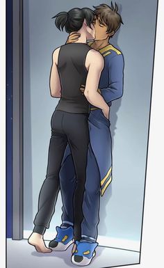 two people standing next to each other in front of a door with their arms around one another