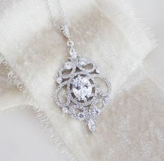 Rose gold bridal necklace perfect for bride or bridesmaid gift Delicate romantic scrolls set with Swarovski Pure Brilliance cz stones. Necklace measures 16 inches and extends to 18 inches. Pendant measures 2 inches x 1-1/8 inch. A perfect pairing to a pair of earrings available in my shop: https://www.etsy.com/listing/246297266/rose-gold-bridal-earrings-rose-gold?ref=shop_home_active_8 Other matching pieces: https://www.etsy.com/listing/456883848/rose-gold-bridal-bracelet-crystal?ref=shop_home_a Elegant Pendant Bridal Necklace For Anniversary, Anniversary Bridal Necklace With Elegant Pendant, Bridal Necklace In White Gold With Intricate Design, Intricate Pendant Necklace For Wedding, Elegant White Gold Necklace For Wedding Gift, Elegant Sterling Silver Necklace For Wedding Gift, Rose Gold Wedding Necklace With Elegant Design, Delicate Pendant Bridal Necklace, Elegant Pendant Bridal Necklace Gift