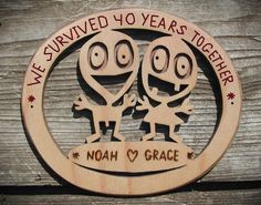 a wooden sign that says we survived two years together, noah and grace on it