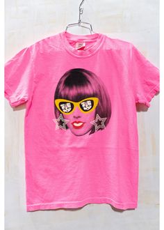 Swiftie of the Year Retro Neon Pink short sleeve tee is just in time to show support for that Woman of the year!! And what a year its been too! Designed in that 1980's Pop Art style in mind in our West Bottoms Underground studios and so fun dressed up or down. Youth sizes S, M, L available and made of 100% pre shrunk soft cotton, this top is designed and screen printed right here in Kansas City. Pop Culture Short Sleeve T-shirt For Spring, Pop Culture Screen Print Short Sleeve Tops, Pop Culture Screen Print Tops For Summer, Summer Screen Print Pop Culture Tops, Summer Pop Culture Screen Print Tops, Summer Pop Culture Cotton T-shirt, Summer Cotton T-shirt With Pop Culture Style, Pop Culture Text Print T-shirt For Summer, Trendy Fan Merchandise Short Sleeve Top