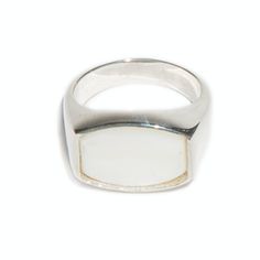 This is our 'Archie' ring from our flat top Thomas collection. With its flat, barrel face adorned with a high polished, 16x12mm white mother of pearl, the 'Archie' ring combines practicality and edge. This unisex signet ring is a go-to piece with endless wearability. White mother of pearl has a tremendous ability to calm and lessen the fears of those who wear it, it is especially helpful for anyone whose life is intense and stressful. White Mother of Pearl No two stones are alike Available in St White Sterling Silver Ring With Polished Finish, White Sterling Silver Rings With Polished Finish, White Dome Ring With Polished Finish For Anniversary, Anniversary White Dome Ring With Polished Finish, Classic White Signet Ring For Anniversary, Elegant White Signet Ring For Formal Occasions, White Sterling Silver Pearl Ring With Polished Finish, White Pearl Ring With Polished Sterling Silver, Classic Mother Of Pearl Rings As A Gift