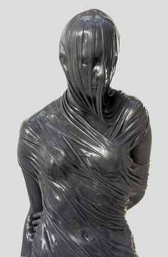 a statue of a woman wrapped in plastic