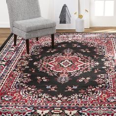 a black rug with red, white and blue designs