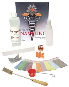 the art of nameling kit includes an assortment of paints and tools