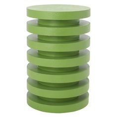 a stack of green plastic discs sitting on top of each other