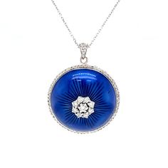 Enamel Jewelry with colorful style! This vintage-inspired modern diamond pendant features blue enamel in 18 karat white gold. A cluster of diamonds decorates the center of the round blue enamel pendant. The blue enamel backdrop showcases a medium-dark Mediterranean blue hue. A halo of accent diamonds surround the pendant and sparkle at the necklace bale. The diamond collection weighs a total of .61 carats. A wearable work of art. Pair with a White Gold Chain Necklace to complete the look. Modern Diamond Pendant, Mediterranean Blue, Diamond Collection, Modern Blue, Enamel Jewelry, Colorful Style, Blue Hues, Colorful Fashion, Diamond Pendant